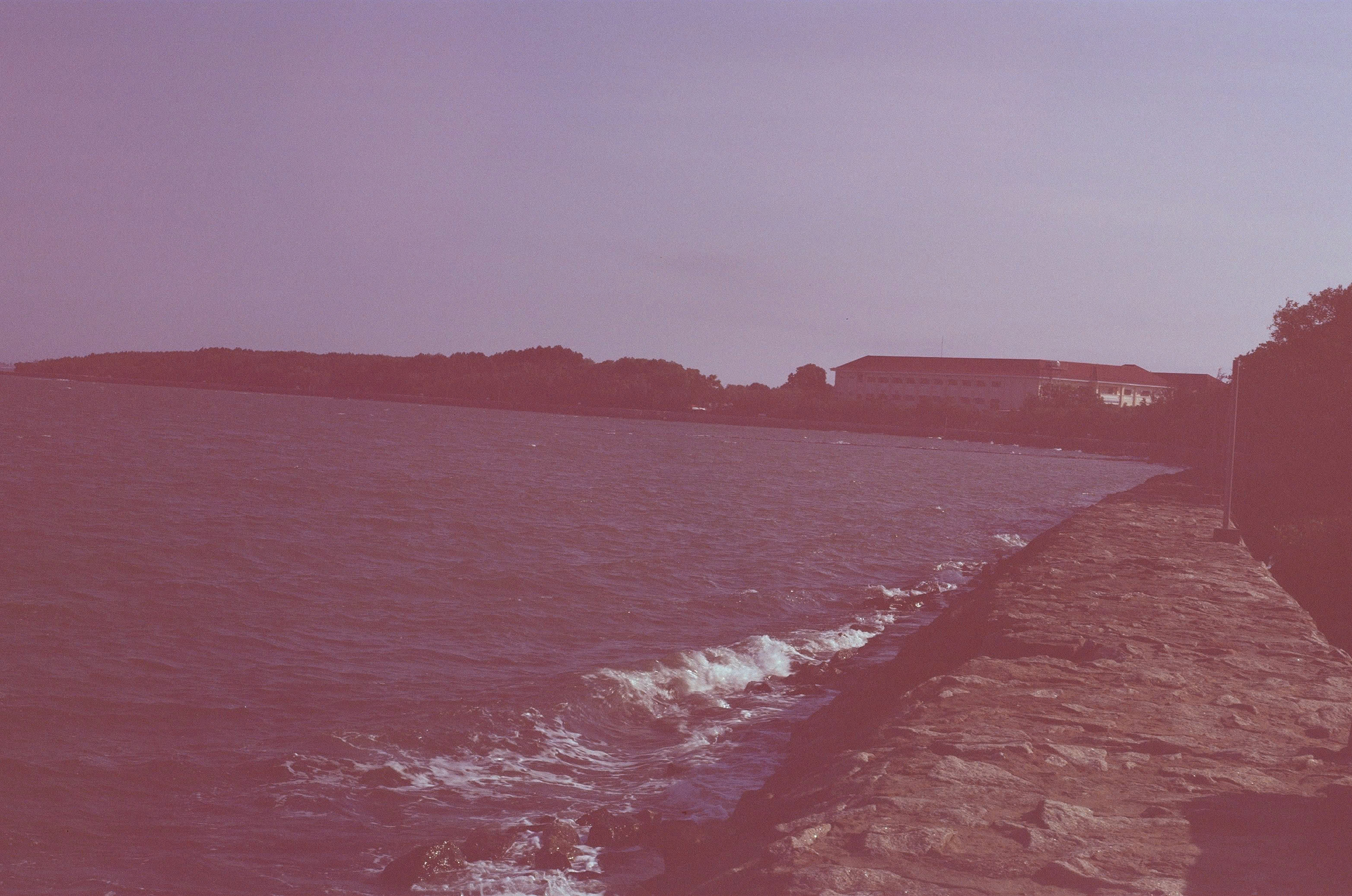 The stone seawall path along Thanh An Island