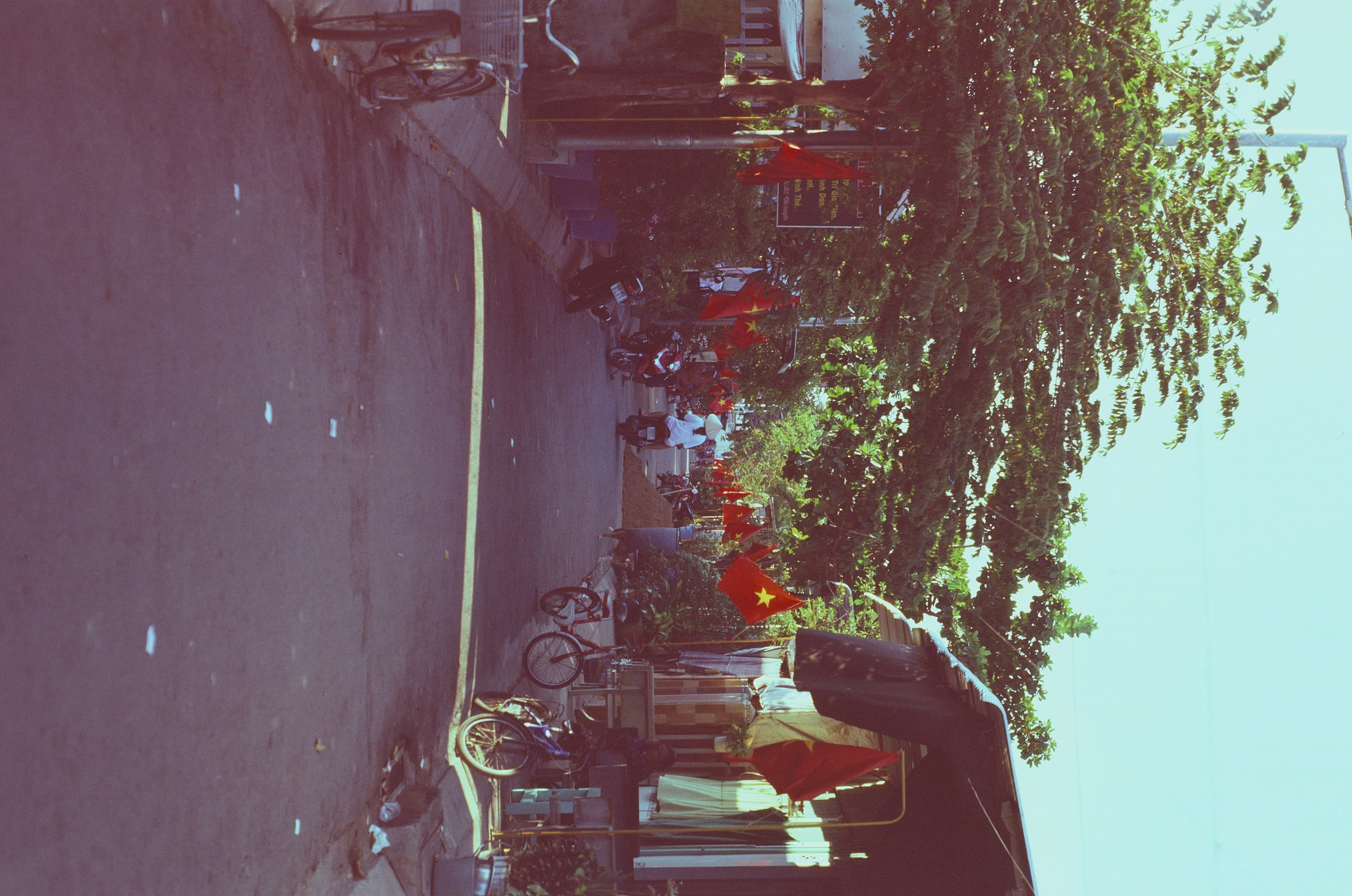 A small street on Thanh An Island decorated with flags
